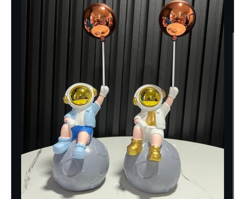 Sitting astronaut with balloon